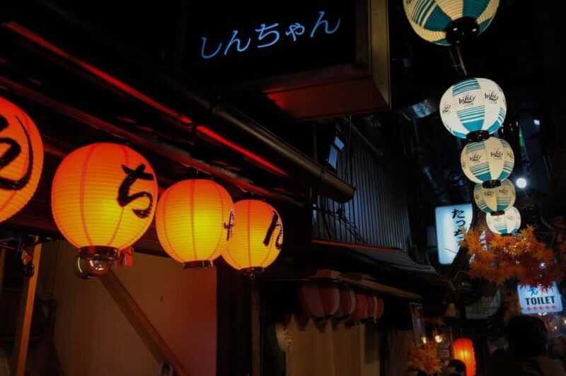 Shinjuku Evening Walk & Traditional Snack Bar Visit - Key Points