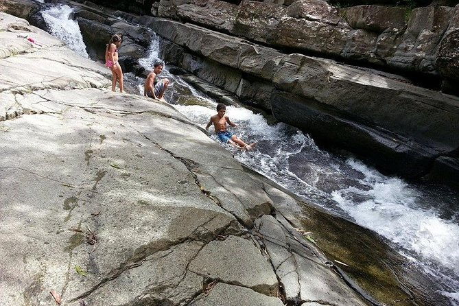 small-groups-el-yunque-waterslide-shopping-and-plus-beach