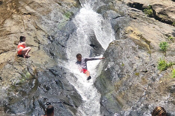 small-groups-el-yunque-waterslide-shopping-and-plus-beach