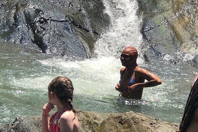 small-groups-el-yunque-waterslide-shopping-and-plus-beach