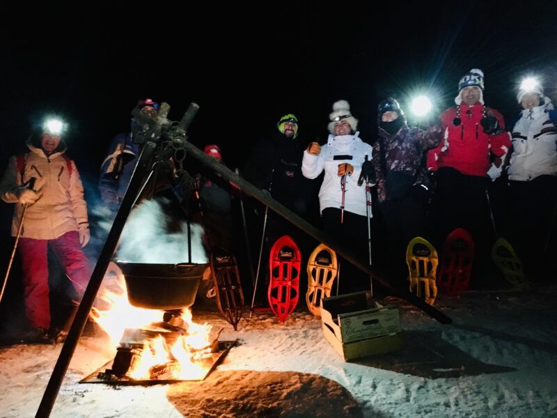 snowshoes-high-altitude-snowshoeing-in-paganella-at-sunset-and-violin-music