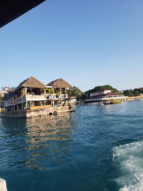 Stone Town: Sunset Dhow Cruise with Drinks, Snacks & Music - The Sum Up