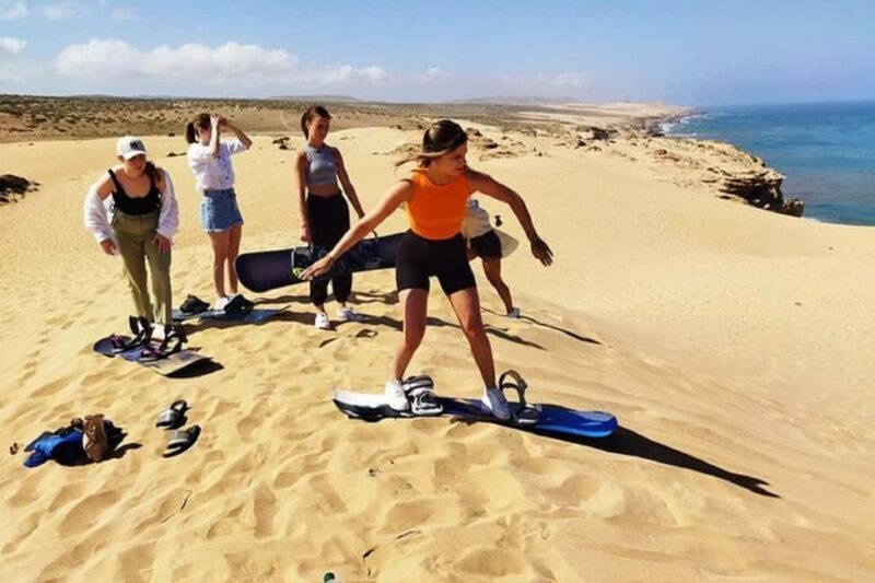 Sunset Desert Camel Ride with Sandboarding and BBQ Dinner - Key Points