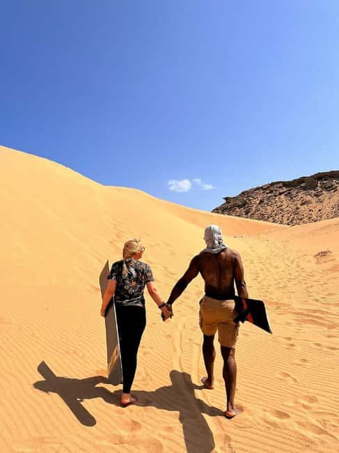 Sunset Desert Camel Ride with Sandboarding and BBQ Dinner - An In-Depth Look at the Experience