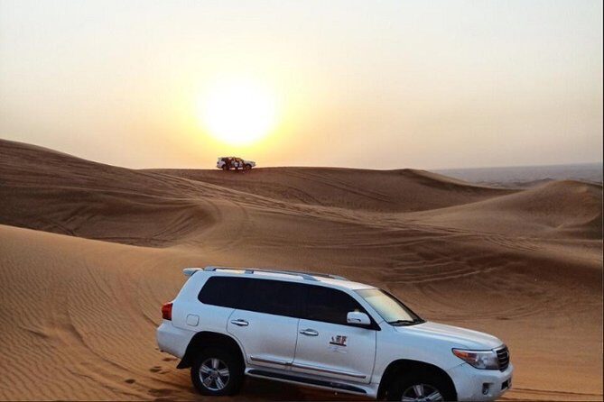 Sunset Desert Safari With BBQ Dinner, Camel Ride, Belly Dancing from Dubai - The Sum Up