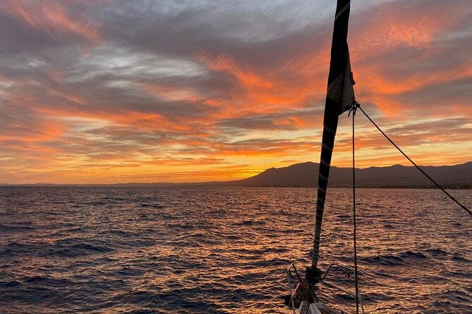 sunset-sailing-along-the-cliffs-of-maro-private