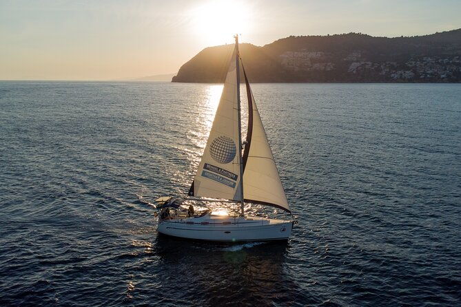 sunset-sailing-along-the-cliffs-of-maro-private