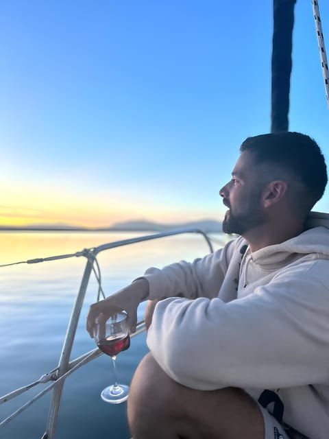 sunset-sailing-trip-along-alghero-coastline-with-aperitif