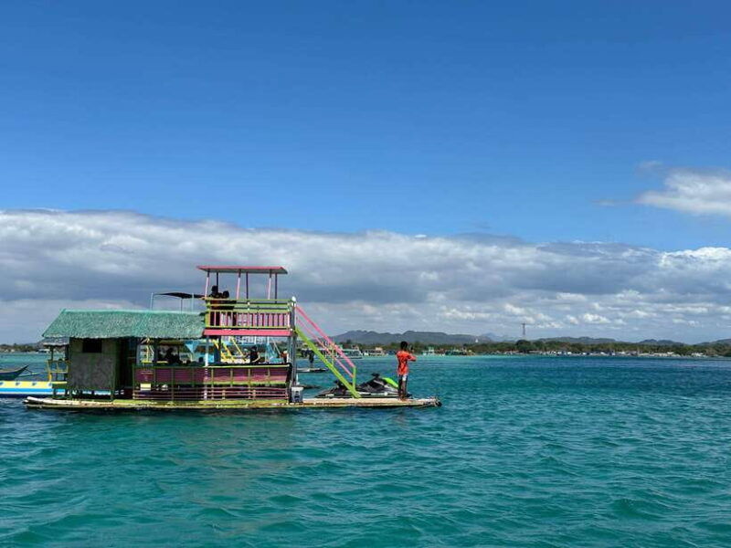 swimming-in-little-boracay-beach-w-floating-bamboo-cottage