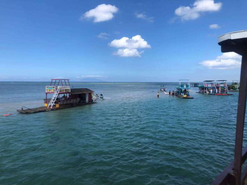 swimming-in-little-boracay-beach-w-floating-bamboo-cottage