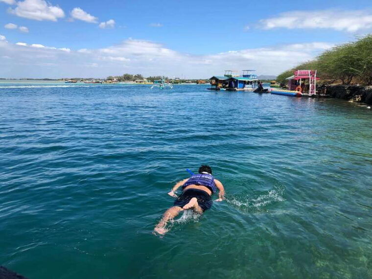 swimming-in-little-boracay-beach-w-floating-bamboo-cottage