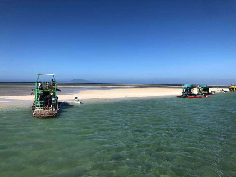 swimming-in-little-boracay-beach-w-floating-bamboo-cottage