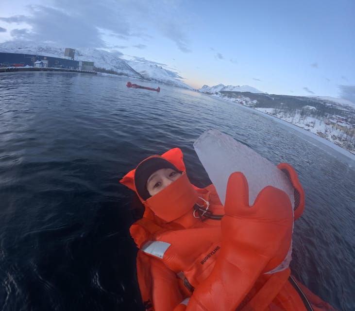 tromso-arctic-fjord-floating-in-survival-suit
