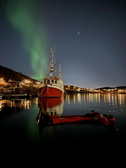 tromso-arctic-fjord-floating-in-survival-suit