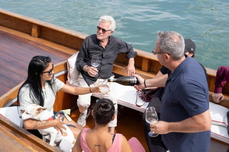 Venice from another point of view: Sightseeing tour in a traditional boat. - The Sum Up