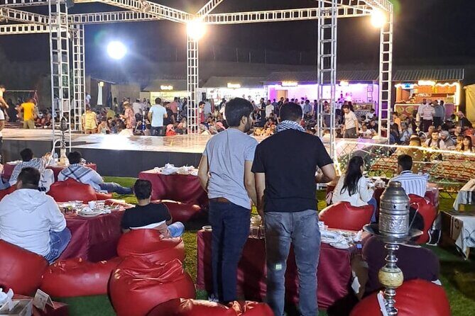 VIP Dubai Desert Safari with Quadbike,Sandboarding & BBQ dinner - Evening at the Desert Camp: Live Shows and a Gourmet BBQ