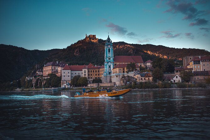 wine-tasting-on-traditional-wooden-boats-in-wachau-valley