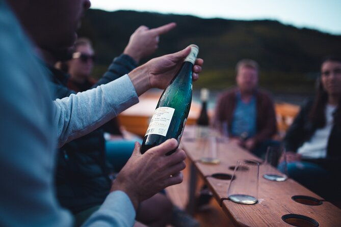 wine-tasting-on-traditional-wooden-boats-in-wachau-valley