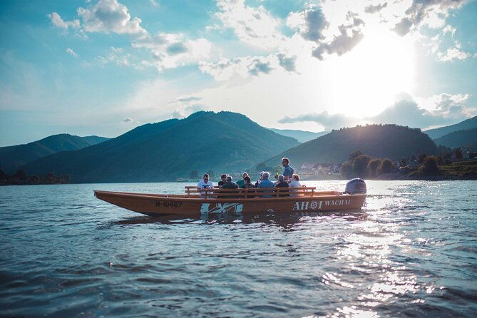 wine-tasting-on-traditional-wooden-boats-in-wachau-valley