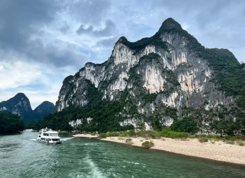 Yangdi Bamboo Rafting, Ancient Stone City& Show Tour - Key Points