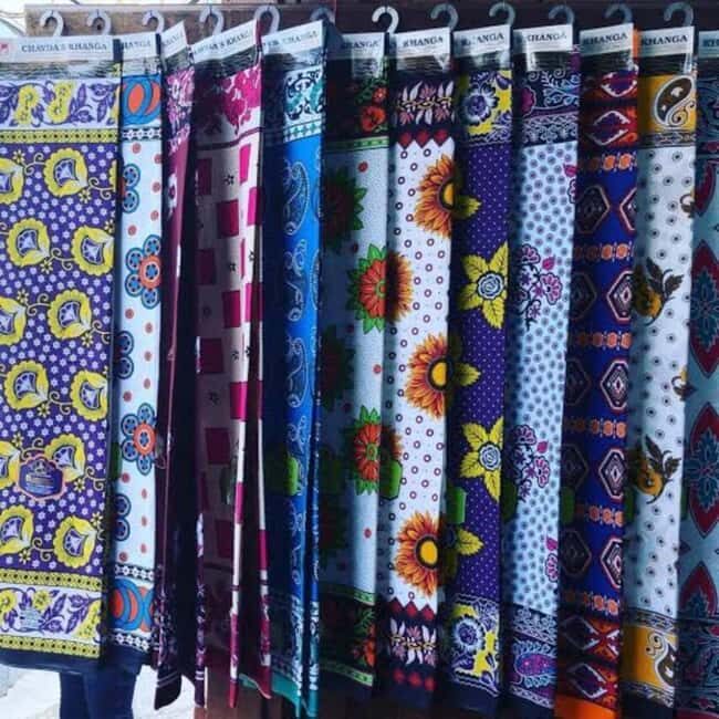 Zanzibar: Stone Town Walking Tour with Shopping & Urojo - Shopping for Tanzanite and Traditional Textiles